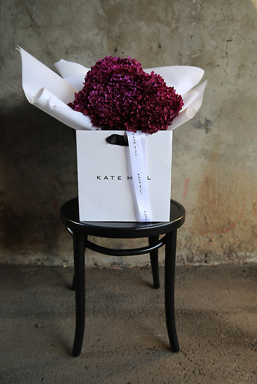 Flower bouquet on bentwood chair ready for delivery to South Yarra