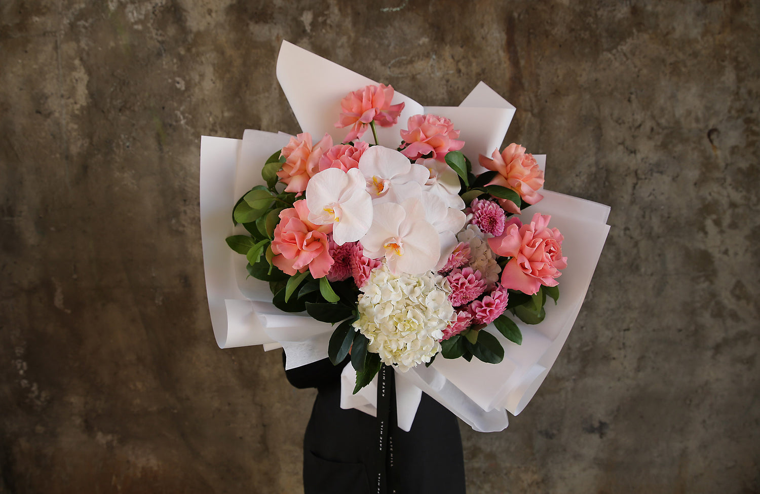 Florist in South Yarra holding bouquet of fresh flowers