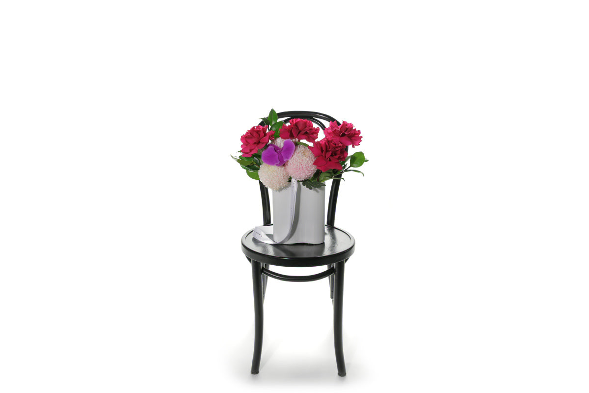 Kate Hill Flowers – medium white-wave vase with hot-pink chrysanthemums, reflexed roses and magenta orchids for congratulations gift.