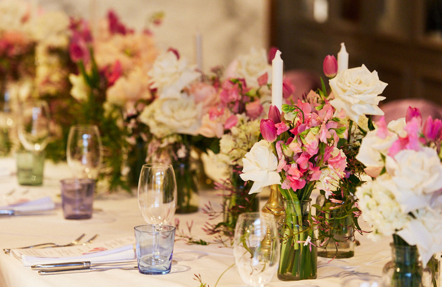 Table setting in Hawthorn restaurant with flowers and candles dow the centre