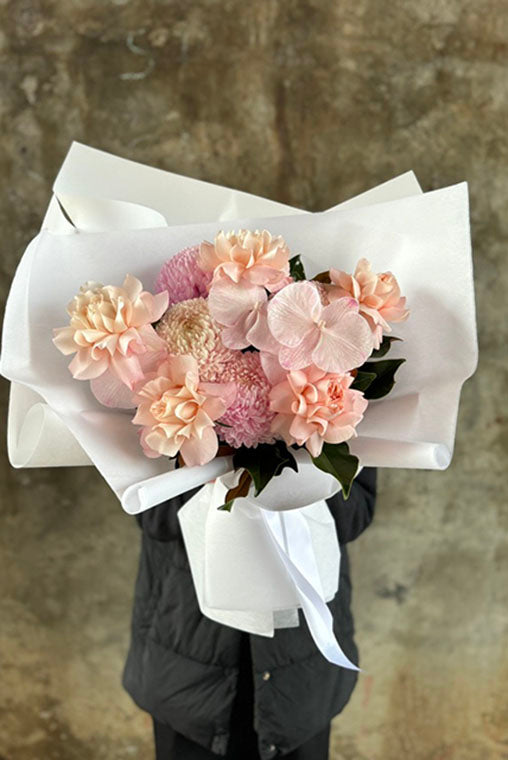 Flower bouquet of mixed pink hues on the way to delivery to Hawthorn