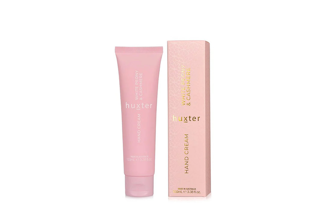 Pink hand cream tube and packaging with &