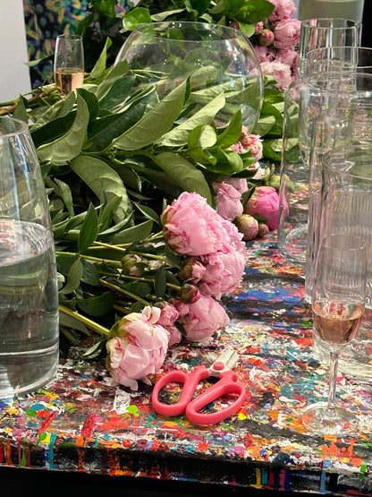 Kate Hill hosting a Peony Rose flower workshop, surrounded by Peony Roses, vases and Plume art work.