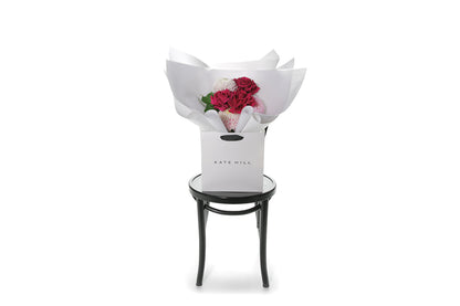 Kate Hill Flowers – small blush and hot-pink birthday posy with Floyd roses, hydrangeas and foliage hand-tied.