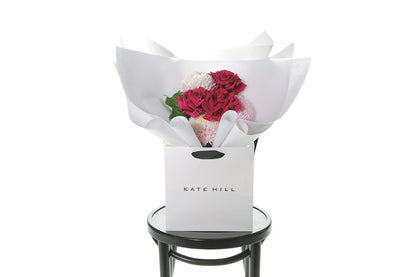 Kate Hill Flowers – small blush and hot-pink birthday posy with Floyd roses, hydrangeas and foliage hand-tied.