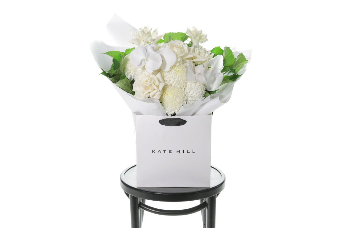 Kate Hill Flowers – large white sympathy bouquet of roses, chrysanthemums and greenery hand-tied.