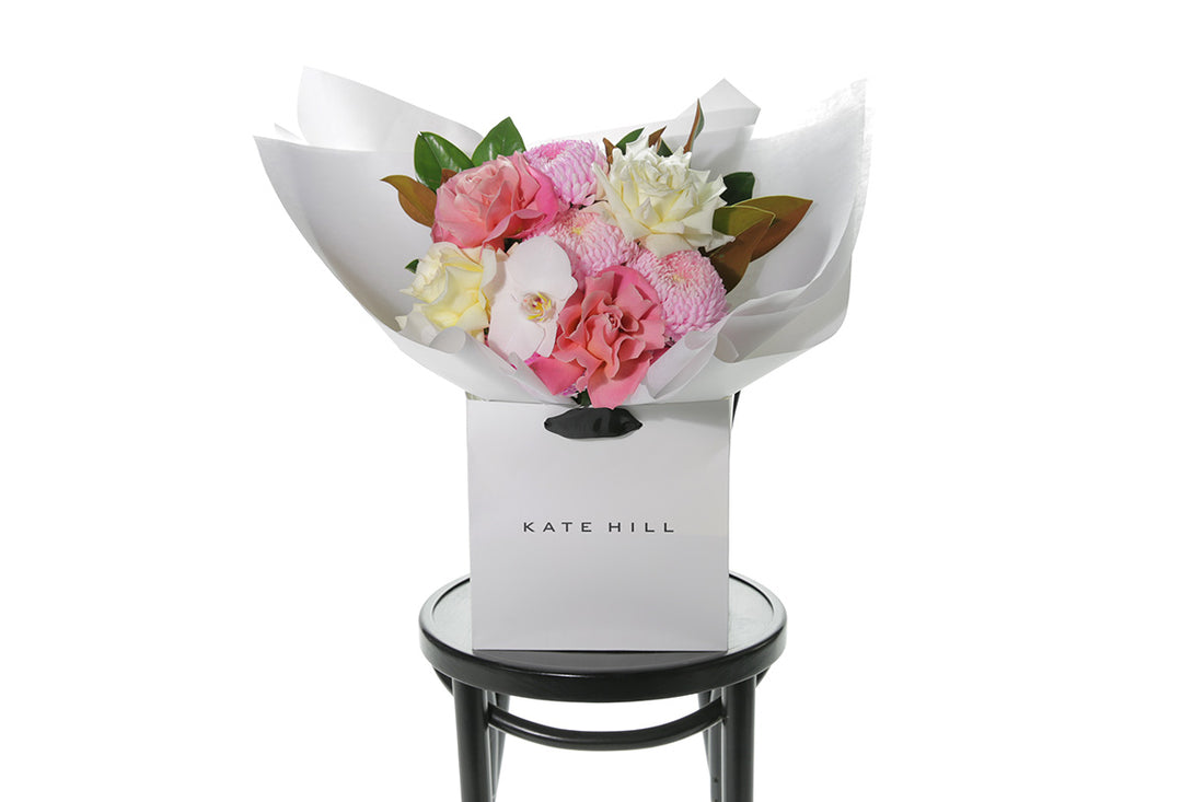 Kate Hill Flowers – medium mixed-pastel birthday bouquet of roses, chrysanthemums, orchids and foliage, hand-tied.