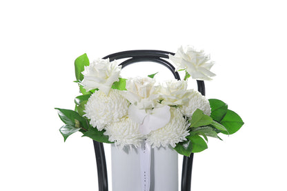 Kate Hill Flowers – medium white sympathy vase with roses, chrysanthemums, orchids and greenery in a wave-ceramic vessel.