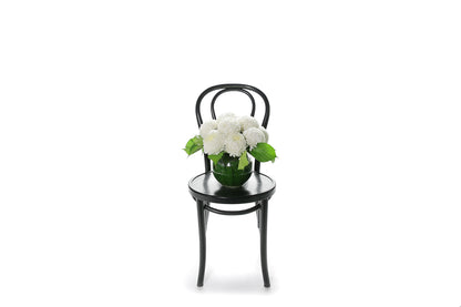 Kate Hill Flowers – white chrysanthemum sympathy ball-vase design with monstera leaf lining.