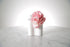 Kate Hill Flowers pink spray rose wrist corsage on a silver elastic wristlet on a marble surface