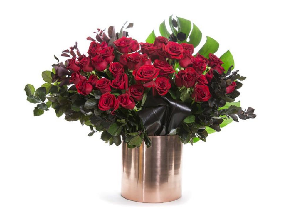 Red Rose Flowers in a bronze container ready for delivery today across Melbourne