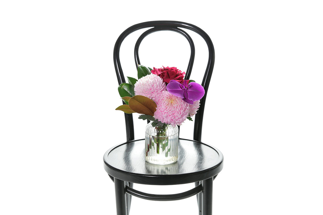 Kate Hill Flowers – small ribbed jar with pink chrysanthemum, hot-pink rose or orchid bloom, ready for birthday gifting.