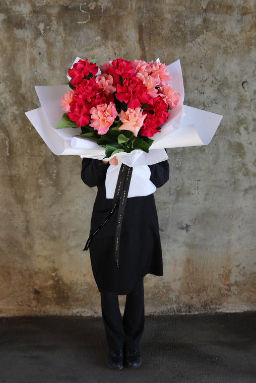 South Melbourne Florist holding Pink Bouquet of Flowers