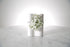 Kate Hill Flowers white gypsophila wrist corsage on a silver elastic wristlet, boxed and ready to wear, displayed on a marble surface.