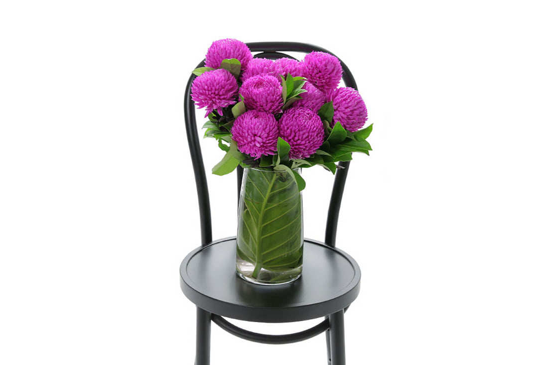 ARIA hot pink disbuds in a tapered glass vase by Kate Hill Flowers Melbourne