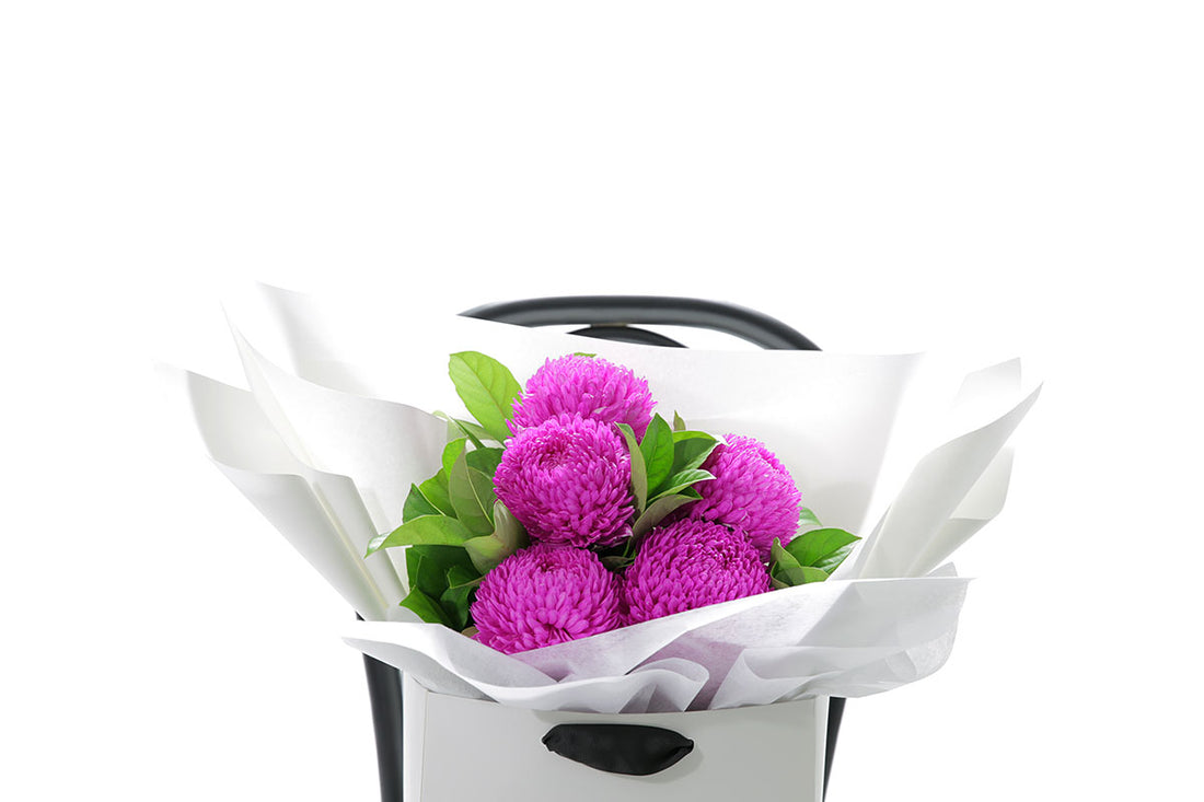 Close-up of ARIA small bouquet with hot pink chrysanthemum disbuds