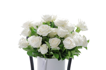 Close-up of BLANCA ceramic design with white roses