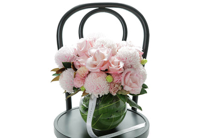 Close-up of CHLOE large ball vase with blush disbuds and soft pink roses