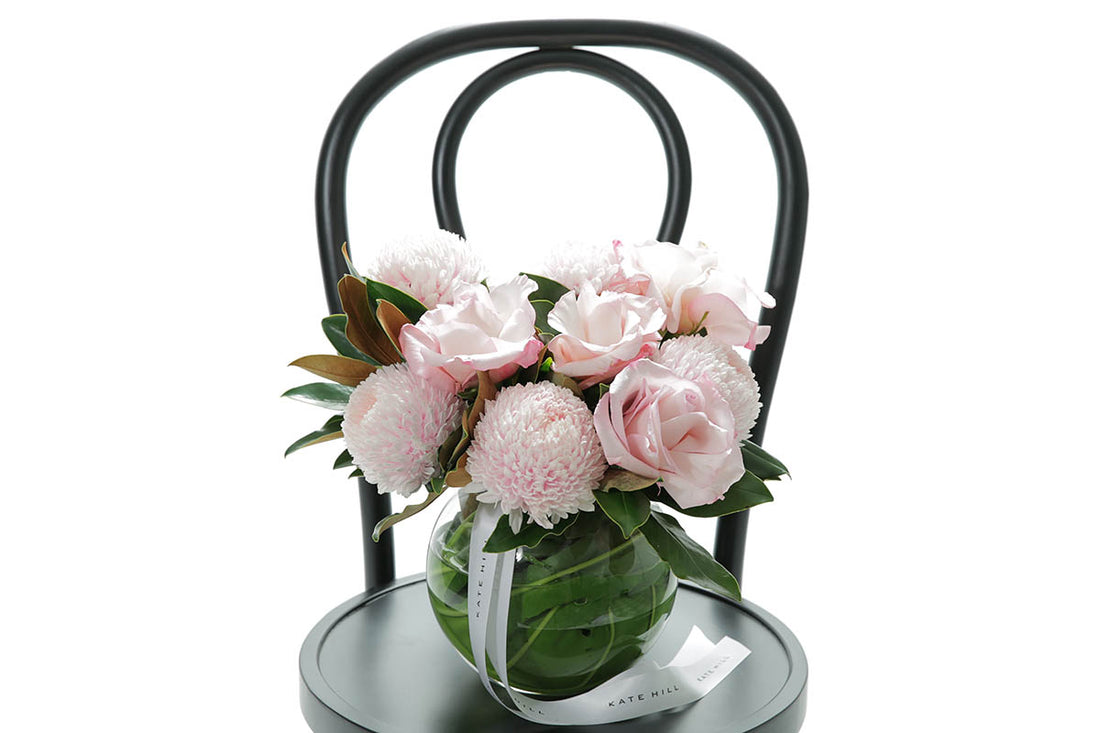 Close-up of CHLOE ball vase with blush disbuds and soft pink roses