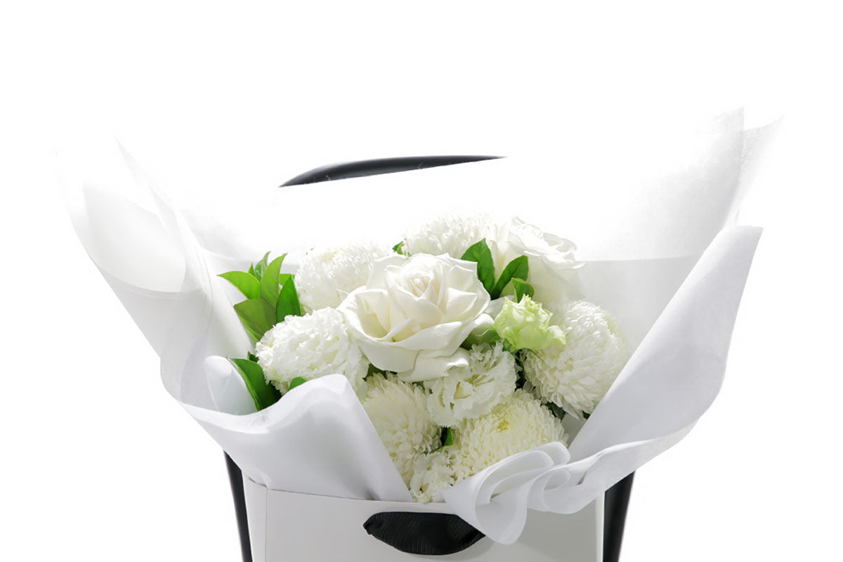 Close-up of ELLA bouquet with seasonal white blooms