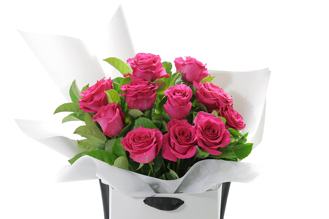 Close-up of FLOYD bouquet with hot pink classic roses