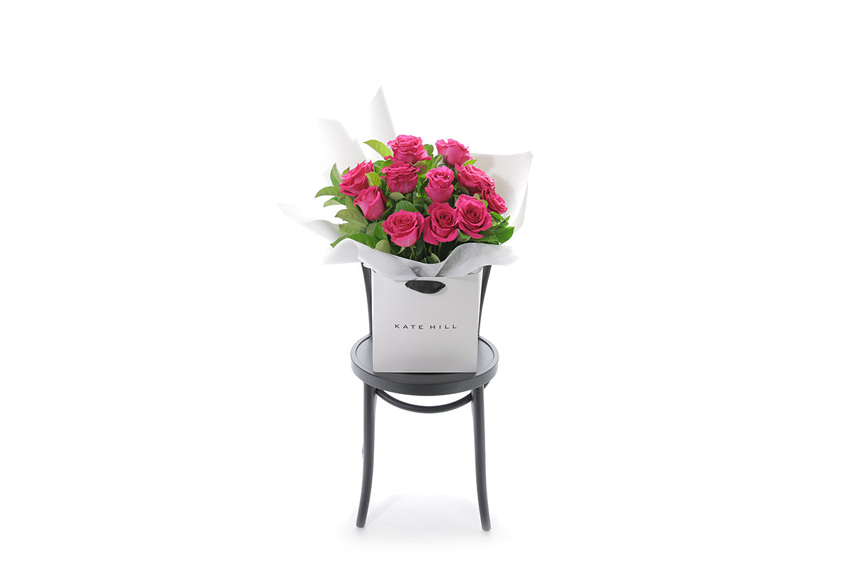 FLOYD hot pink rose bouquet in Kate Hill Flowers signature wrapping