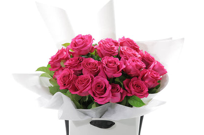 Close-up of FLOYD large bouquet with hot pink classic roses