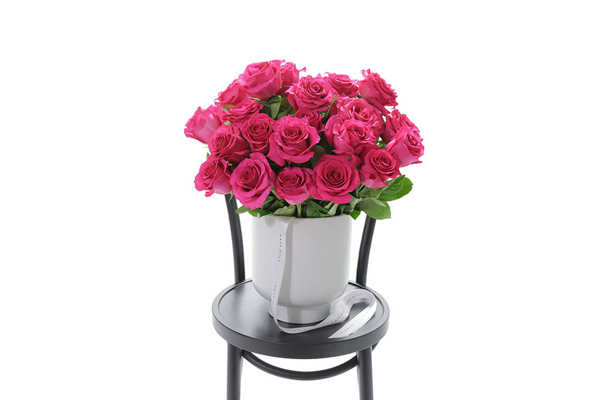 FLOYD hot pink roses in a white footed ceramic design by Kate Hill Flowers Melbourne