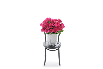 FLOYD 20 hot pink roses in an extra large white footed ceramic vessel
