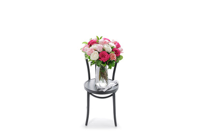 HALEY 20 mixed-colour roses in a tapered glass vase lined with monsteria