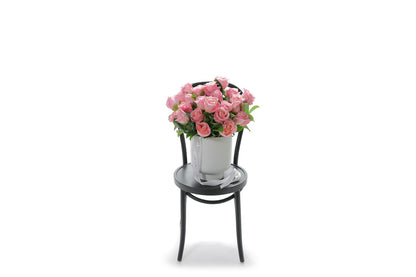 HERMOSA 20 watermelon roses in an extra large white footed ceramic vessel