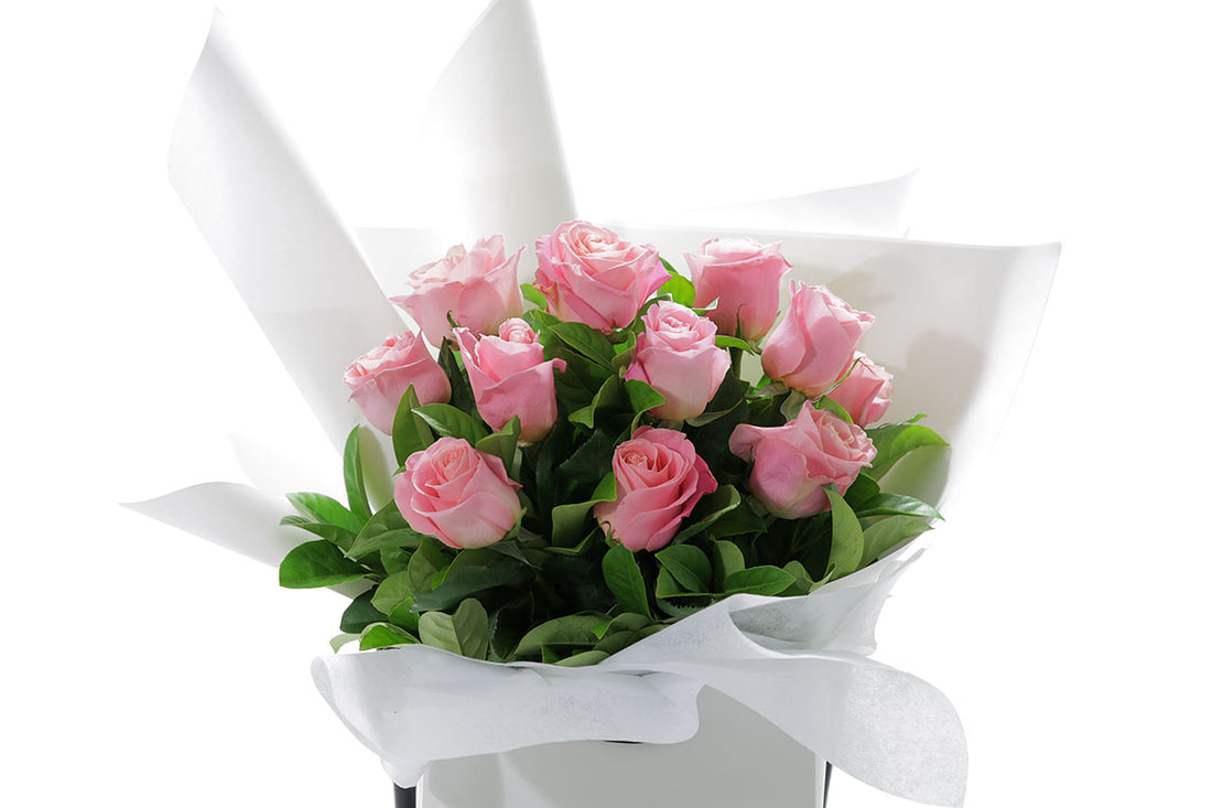 Close-up of HERMOSA bouquet with watermelon classic roses