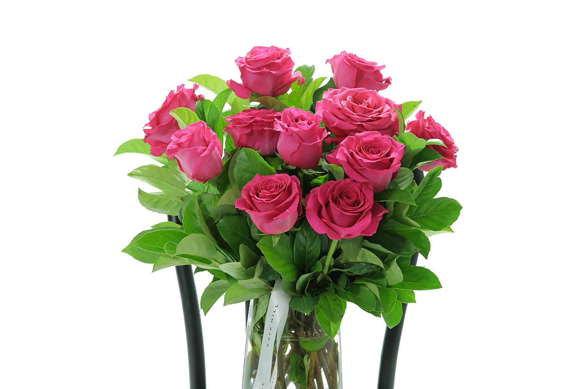 Close-up of SASKIA tapered vase with hot pink roses