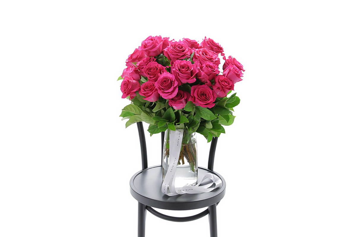 SASKIA large hot pink roses in a tapered glass vase by Kate Hill Flowers Melbourne