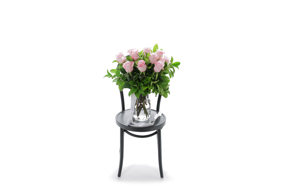ZARA soft pink roses in a tapered glass vase lined with monsteria